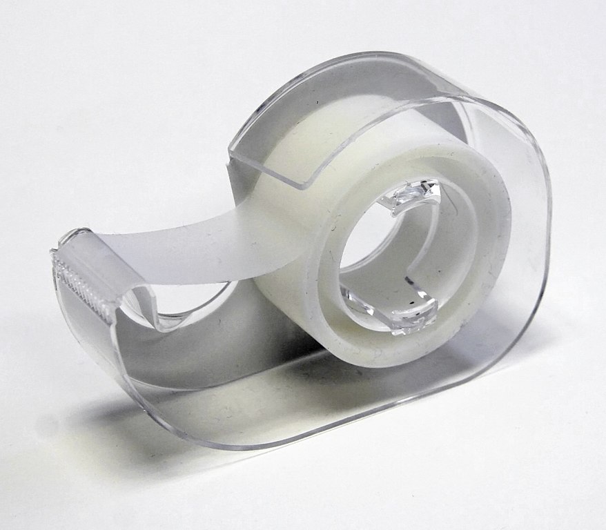 Photograph of a roll of adhesive tape in a tape dispenser.